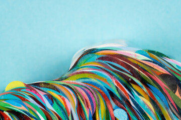 Bright color artwork on turquoise surface