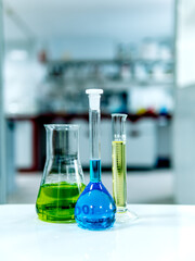Glass chemistry in a laboratory background. Selective focus