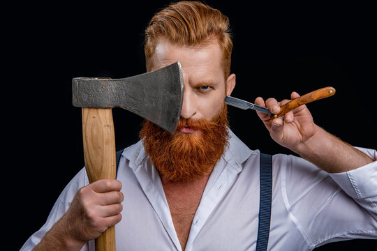 Barber Man In Studio. Barber Man With Ax And Retro Razor Blade. Photo Of Barber Man