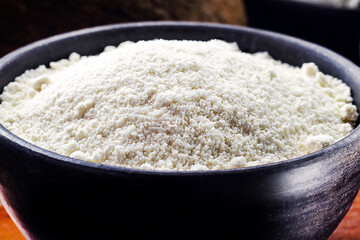 organic coconut flour, with grated coconut in the background, culinary ingredients for fruit sweets, MACRO PHOTOGRAPHY