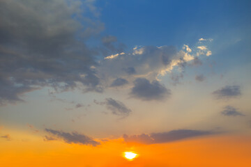 blue cloudy sky at the dramatic sunset, evening sky background