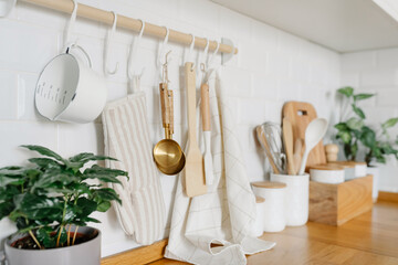 View of white modern country style kitchen interior with hanging storage, eco friendly food storage.