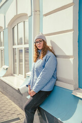 Portrait of a stylish woman in blue jacket. Spring outdoor portrait.