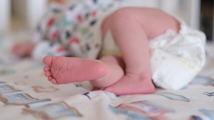 sleeping newborn baby small pink feet 