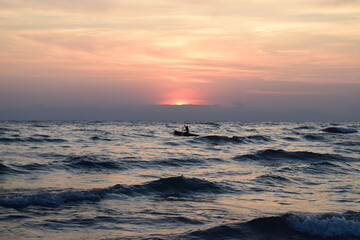 A fishing boat on Lake Malawi at sunrise