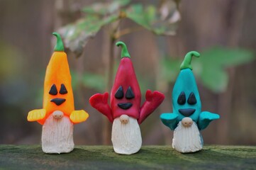 Figures of gnomes dressed up for Halloween. Funny toys.
