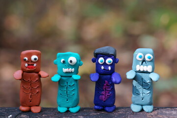 Funny monsters made of plasticine. Various figures. Ideas for Halloween.