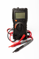 Digital multimeter with probes and display isolated on white background. Electrical tool.Black...