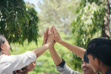 Group of Business people hight five gestures after success deal with team. The gesture of...