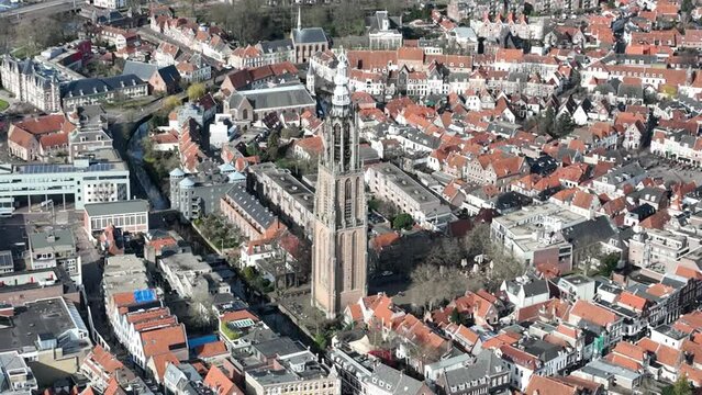 An enchanting aerial perspective of the Onze Lieve Vrouwetoren, magnificent church in the heart of Amersfoort, highlighting its unique charm and the bustling city life around it.