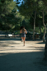 Fototapeta premium Active woman exercising in a park outdoors