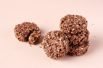 cookies made of cereals and chocolate on a beige background