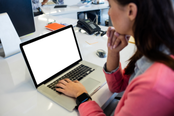 Woman working on laptop at office