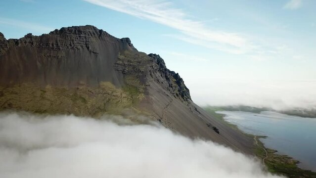 4K cinematic Aerial drone footage of Vestrahorn in Stokksnes. Iceland landscape with stunning mountains hidden in the mist. High quality 4k footage