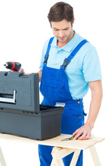 Carpenter removing tools from box
