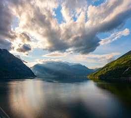 Amazing views of Norwegian fjord landscape with snow mountains from cruise ship sailing through the Eidfjord, Norway 