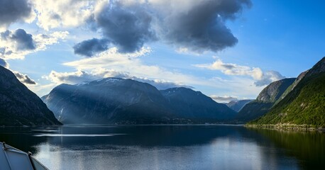 Amazing views of Norwegian fjord landscape with snow mountains from cruise ship sailing through the...