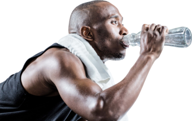 Close-up of muscular man drinking water