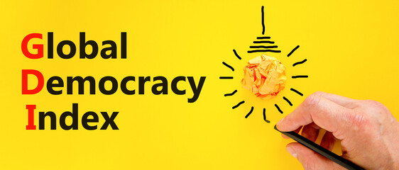 GDI global democracy index symbol. Concept words GDI global democracy index on paper on beautiful...