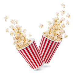 Two striped buckets with popcorn flakes isolated on a white background. - obrazy, fototapety, plakaty
