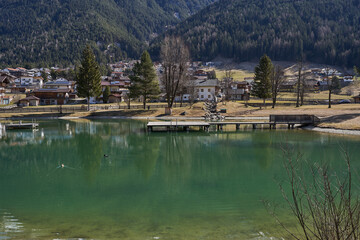 Fototapeta na wymiar Kampl, Austria - March 16, 2023 - the Lake Kampler in an alpine valley Stubaital at the end of the winter season