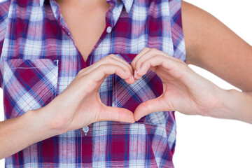 Woman making heart shape with hands 