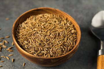 Fototapeta na wymiar Dry Organic Raw Cumin Seeds