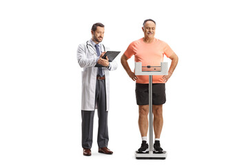 Mature man standing on a medical weight scale and a doctor standing behind him