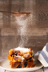 cake with nuts with falling sugar on top