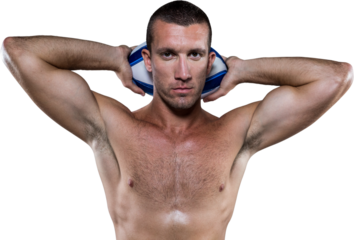 Handsome shirtless rugby player holding ball