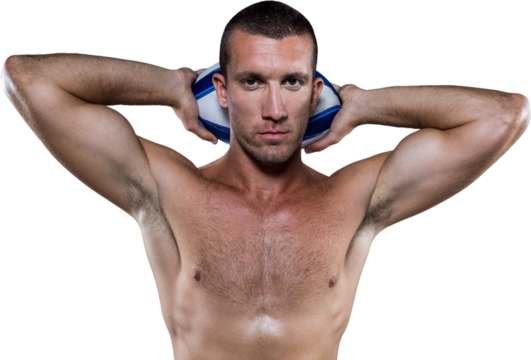 Handsome shirtless rugby player holding ball