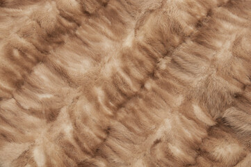 woolen brown background. fleecy yellow texture. the concept of wool products. fur soft orange surface