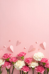 Mother's day concept. Top vertical view flat lay of beautiful carnation flowers pink paper hearts on pastel pink background with empty space for text or advert Perfect for your mother's day branding - obrazy, fototapety, plakaty