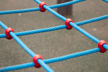 red and green rope. Blue ropes intersect. Playground.