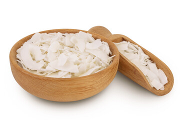 Coconut flakes or chips in wooden bowl isolated on white background with full depth of field