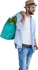 Young model holding bag with vegetables