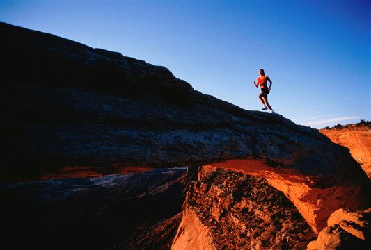 Woman Running Up Hill