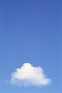 Lone Cloud in Blue Sky