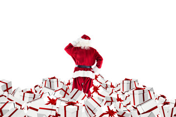 Santa standing on pile of gifts