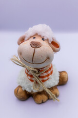 Fototapeta na wymiar Smiling handmade sheep figure.