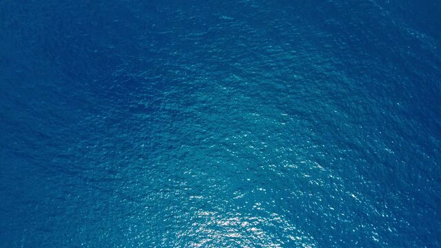 Aerial top down view from high altitude of blue azure turquoise sea water texture. a view of the water surface. Background of the water surface. 4k
