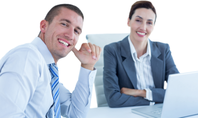 Portrait of smiling business people sitting at desk