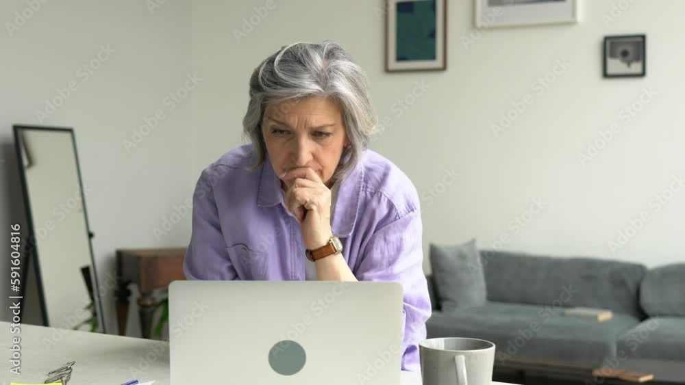 Poster aged caucasian woman using netbook application for online browsing web information while blurred gra