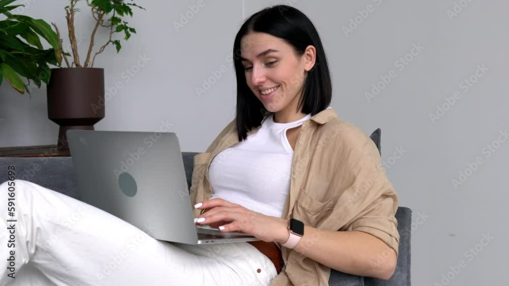 Poster joyful caucasian woman using laptop computer for chatting and messaging in social networks, cheerful