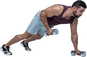 Muscular man doing push ups with dumbbells