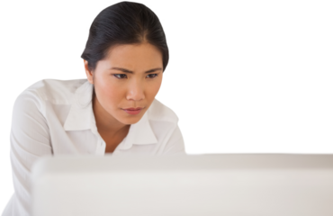 Casual businesswoman concentrating at her desk