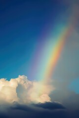Naklejka na ściany i meble a rainbow with clouds in the sky