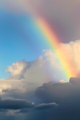 Plakat rainbow over stormy sky with clouds