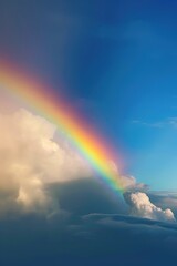 Obraz na płótnie Canvas rainbow over stormy sky with clouds