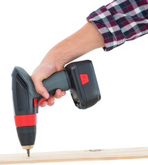 Male carpenter drilling hole in wood